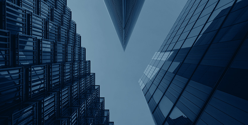 Upward view of modern glass skyscrapers converging toward the sky, cool blue duotone, calm and corporate mood